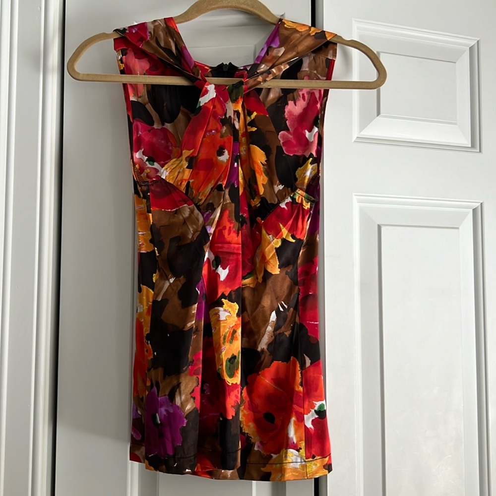 Silky flowery adorable top wish it still fit